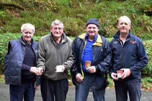 Con Kelleher presenting Paddy O Keeffe,Eugene O Sullivan and Ned Kelleher with prizes for Skittles 